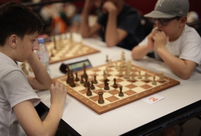 boys thinking at chess